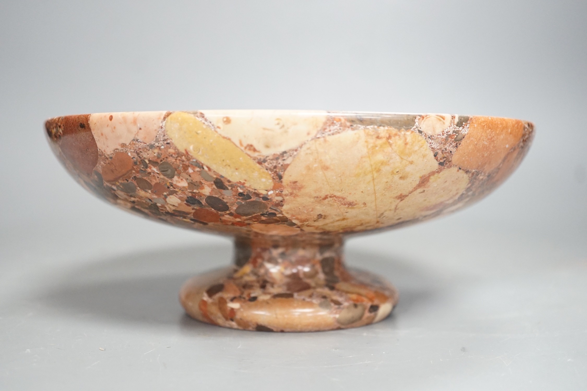 A small polished puddingstone tazza, 23cms diameter